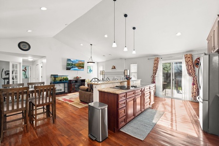 View of kitchen island and living room