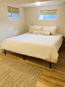 Bedroom with King bed and super comfy Sealy Posturepedic mattress. Please note: part of the ceiling is low.