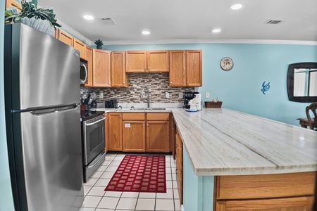 Kitchen with stainless steel appliances.