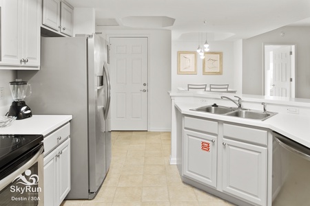 KItchen has white cabinets.