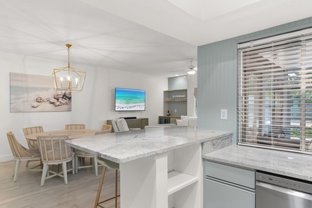 Bright and breezy, this open layout features coastal tones, sleek counters, and relaxed beachy charm.