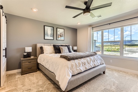 Primary bedroom with an AMAZING view of the Rocky Mountains!