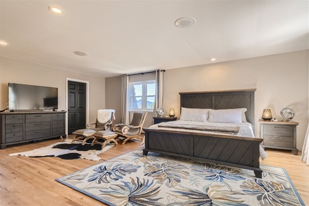 Primary Bedroom w/sitting area in front of wood burning fireplace