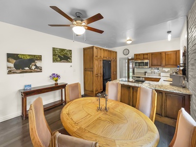 Spacious dining table, nomad workspace, full refrigerator, stove, and dishwasher