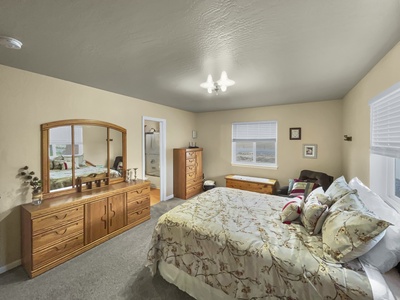 Comfy queen bed, spacious closet, private connected full bathroom.