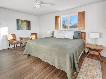 Master bedroom with king bed and sitting area