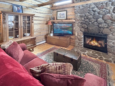 Living room with gas fireplace and smart TV