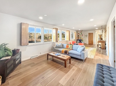 Spacious living room with wood shutters and great views