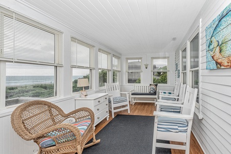 Enclosed sun porch runs the length of the house