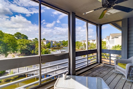 Balcony 1 (screened in) with water views located off the Living Room