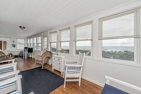 Relax and take in ocean views and the beach from the enclosed porch Relax and take in ocean views and the beach from the enclosed porch 