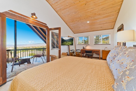 Upstairs Primary Bedroom (king bed). Enjoy a morning cup of Kona coffee from the lanai while taking in the incredible views of Maui. There is also a desk, printer /scanner. Perfect for working remotely.