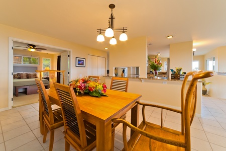 Formal dining area with an elegant "tropical" motif. Close to kitchen for easy serving, including pass through area. Kitchen / Dining table has beautiful "island style" hard wood. Includes seating for 6 people.