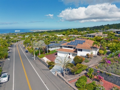 This gorgeous home (red roof) is in an upscale, safe neighborhood.  Enjoy comfortable elegant accommodations in paradise! Drone vantage of this gorgeous home (red roof) in upscale, safe neighborhood.  Enjoy comfortable elegant accommodations in