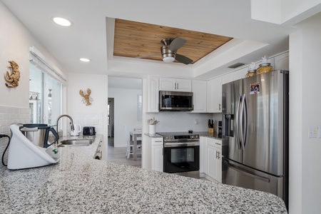 Kitchen With Rustic Accent Ceiling