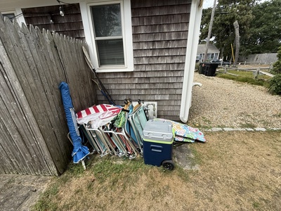 beach chairs, umbrella, boogie boards and cooler to use