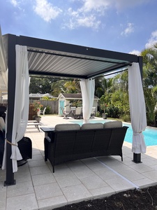 Gazebo with privacy curtains and seating