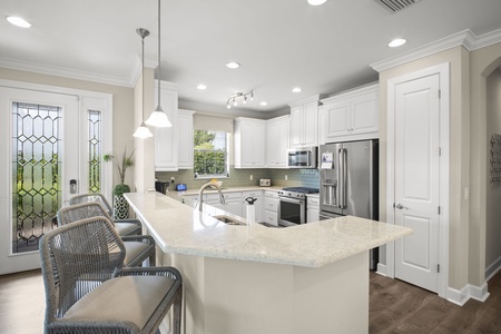 Open kitchen with stainless steel appliances