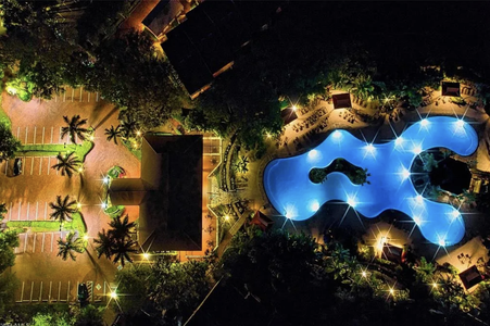 Night view of clubhouse and resort pool