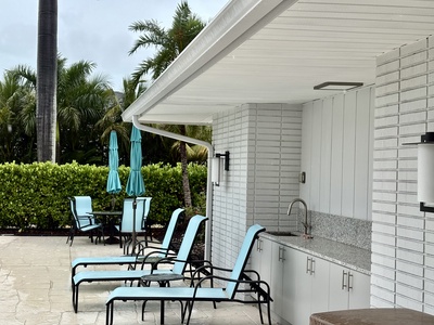 Pool loungers and kitchen