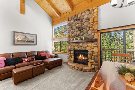 Cozy up in our inviting family room, featuring a warm fireplace and a large sofa—ideal for sharing stories and making memories after a day of fun!