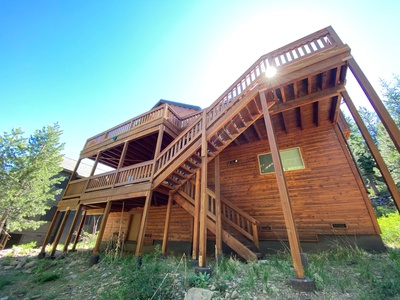 Stunning view from the backyard, showcasing the expansive deck system that invites outdoor living and relaxation