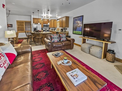 Cozy Living Room with Fireplace and Big Screen TV