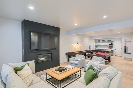 Cozy up with family and friends in the living room featuring a welcoming fireplace – the perfect spot for quality time together. Cozy up with family and friends in the living room featuring a welcoming fireplace – the perfect spot for quality time togethe