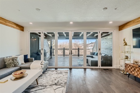 Lovely Open Living Room with Large Glass Patio Doors!