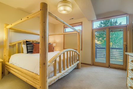 Primary Bedroom with Balcony View