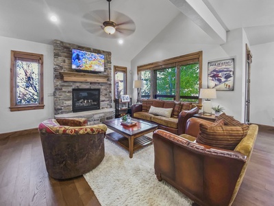 Cozy Living Room with Fireplace and Big Screen TV