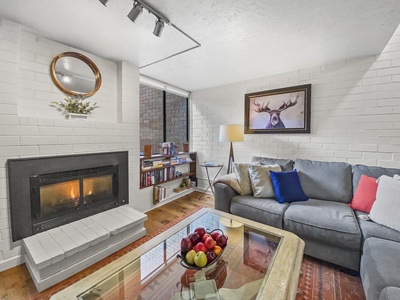 Cozy Living Room with Fireplace and Big Screen TV