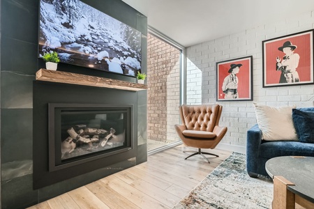 Cozy Living Room with Fireplace and Flat Screen TV