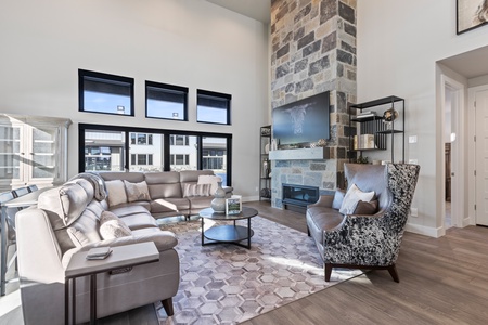 Cozy Living Room with Fireplace and Big Screen TV