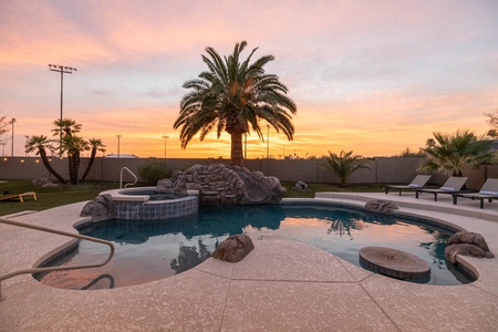 Soak up the desert's magic at sunset, while lounging poolside in our serene backyard oasis