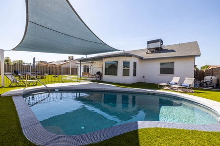 A sparkling play pool with shade structure perfect for the kids (and kids at heart) to cool off!