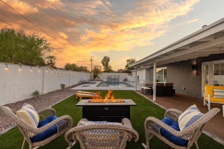 Have a drink overlooking the pool, by the fire pit.