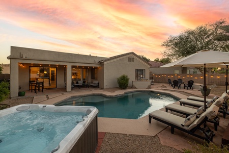 An outdoor haven with spa and heated pool