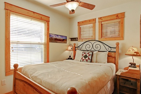 Queen bed in the upstairs bedroom.