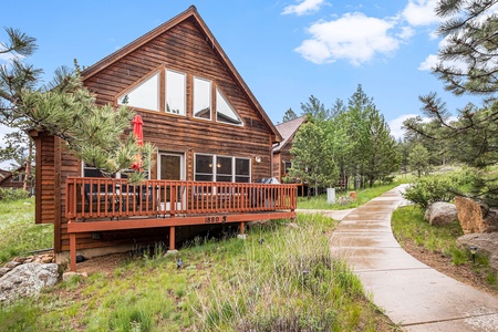 Exterior of cabin, with large deck.