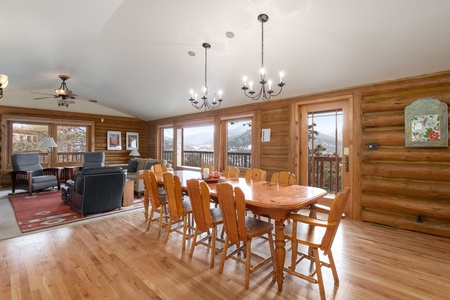 Open concept dining room with seating for ten guests. Beautiful mountain views from your windows. Sliding glass door to access your deck.