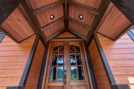 Front door up steps. Guests enter through garage.