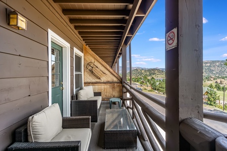 Cushioned patio seating on the condo's deck.