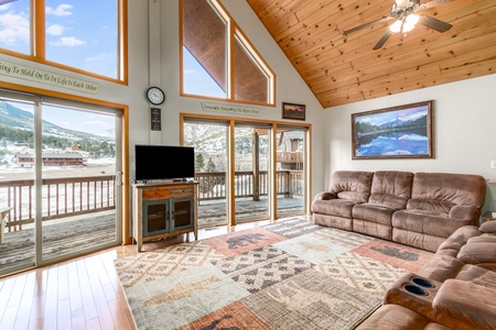 Floor-to-ceiling windows in the living area provide spectacular views of Twin Sisters and Longs Peak