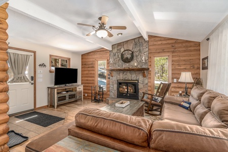 Lazy Elk Retreat Estes Park, living room features a fireplace.