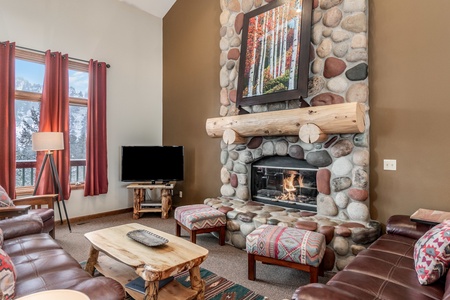 Living room with gas fireplace and flat screen TV