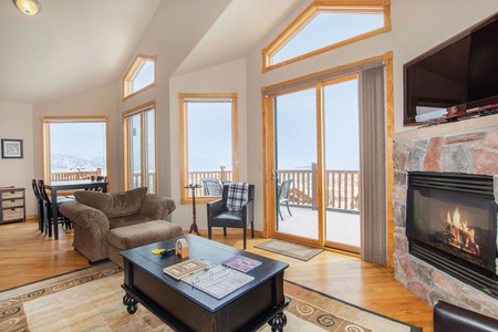 Cubble up in the oversized chair with ottoman in front of a warm fire and flat screen TV. 