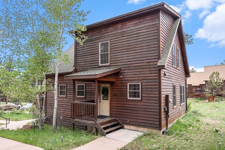 Exterior view of Marmot 2, front door with small covered porch.