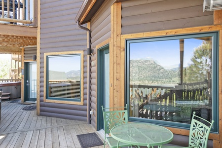 Cafe table and chairs for 2 on condo's deck.