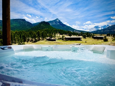 Enjoy mountain views from the newly-installed hot tub on the lower patio